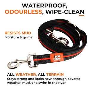 Coiled black and orange Canny Dog Training Lead with steel clips; waterproof, wipe-clean and resists mud and moisture.